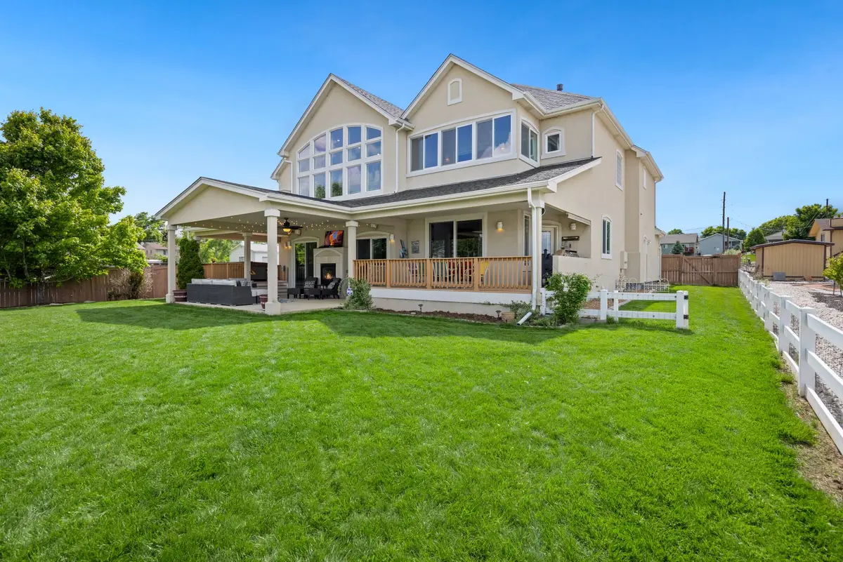 Two-story house with a wraparound yard